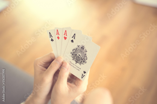 Asian women playing cards at home.