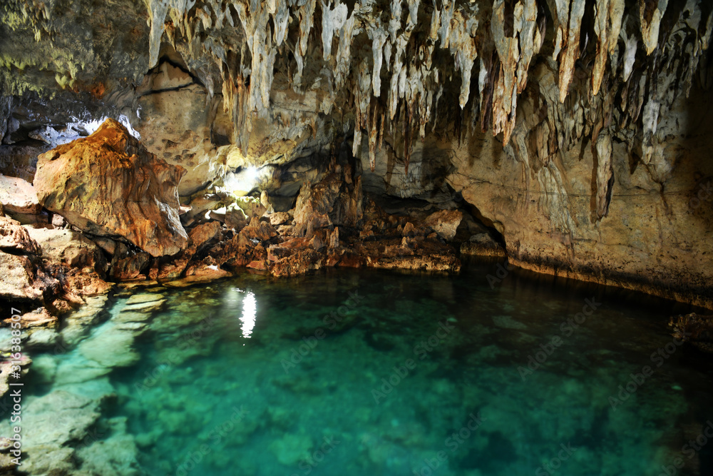 Fototapeta premium cave with underground lake on a tropical island in the philippines