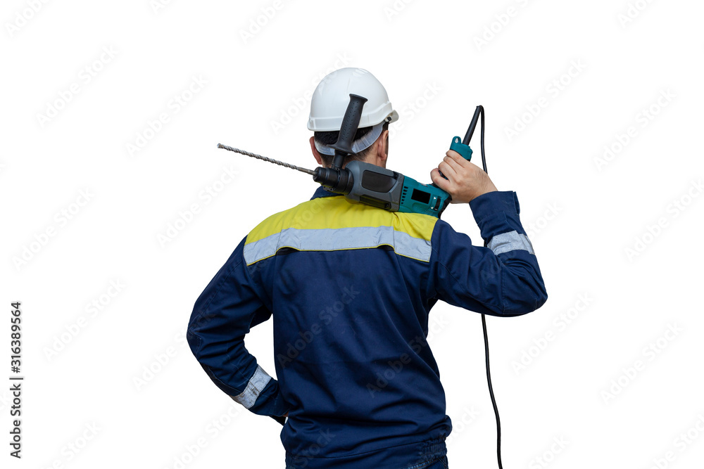bearded young builder in helmet using the drill. white background. Personal protective equipment bearded young builder in helmet using the drill. white background. Personal protective equipment