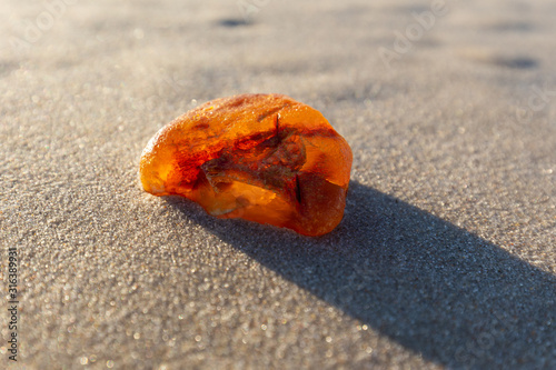 Amber on the beach in the Slowinski National Park. Czolpino, Leba, Poland.