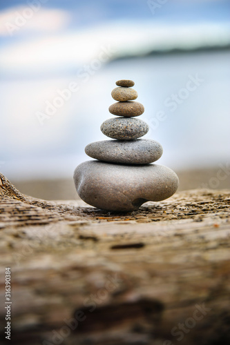 Canvas Print Cairn stone stack smooth stones at beach