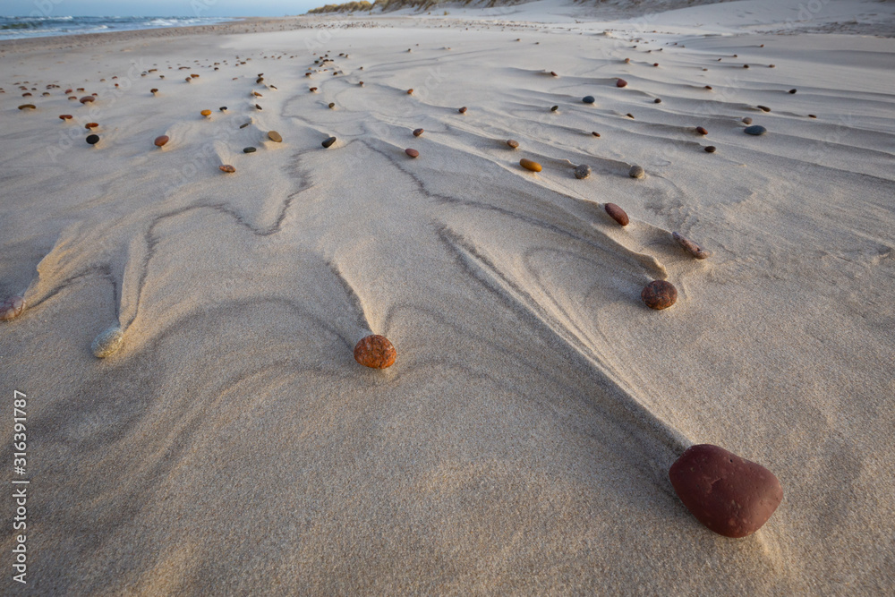 Beautiful patterns created by the wind on the beach in the Slowinski National Park. Czolpino, Leba, Poland.