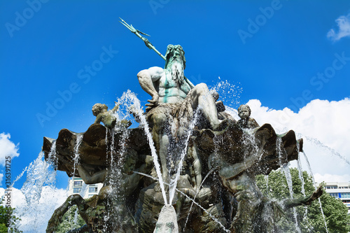 Neptune fountain in Berlin. It located in the center of Berlin between the Marienkirche church and the Red Town Hall.
