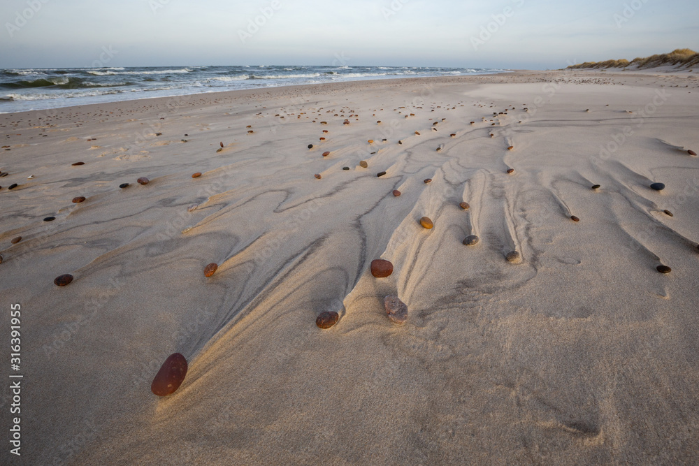 Beautiful patterns created by the wind on the beach in the Slowinski National Park. Czolpino, Leba, Poland.