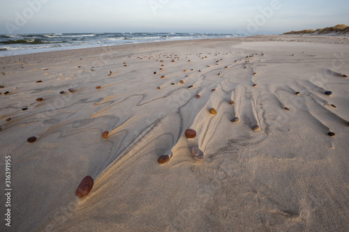 Obraz na płótnie Beautiful patterns created by the wind on the beach in the Slowinski National Park. Czolpino, Leba, Poland. w salonie