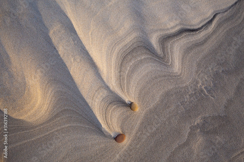 Obraz na płótnie Beautiful patterns created by the wind on the beach in the Slowinski National Park. Czolpino, Leba, Poland. w salonie