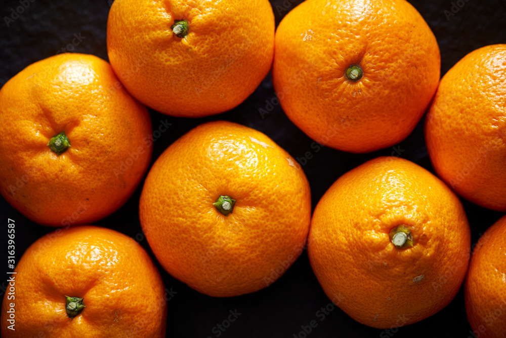 Orange fruit on black background Orange fruit on black background