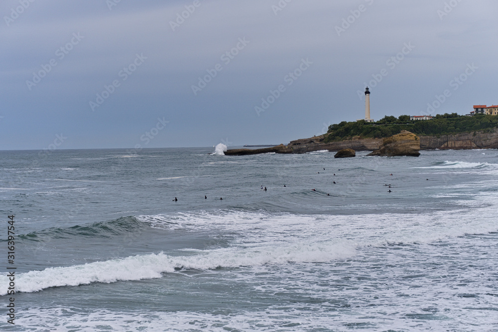 A rough sea in Biarritz, France with the lighthouse in the background
