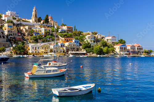 The picturesque coastline of Symi with beautiful old houses, Symi island, Dodecanese, Greece