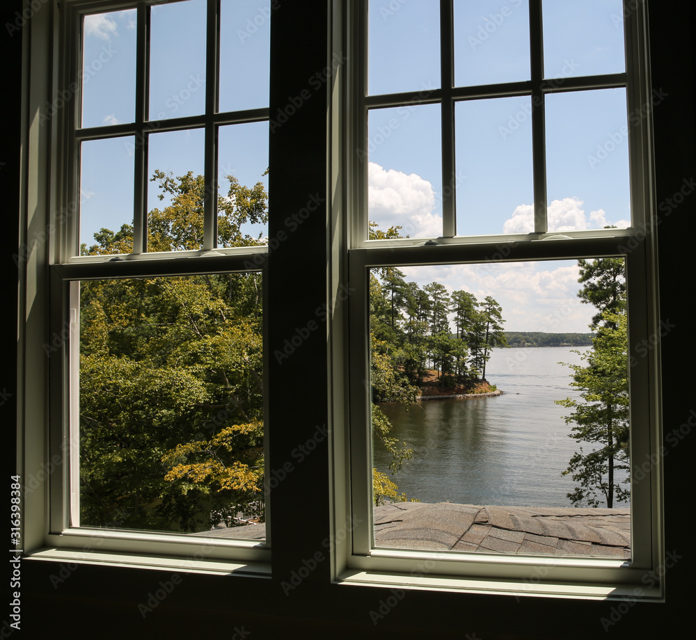 Window with view of a lake in the distance Window with view of a lake in the distance