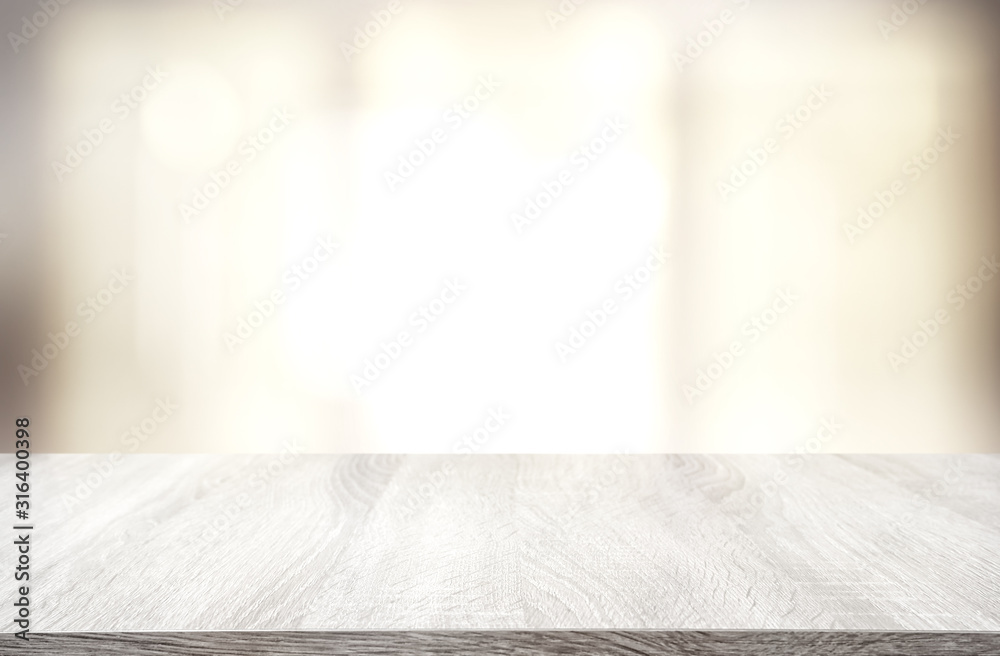 image of wooden table in front of abstract blurred window light background - obrazy, fototapety, plakaty 