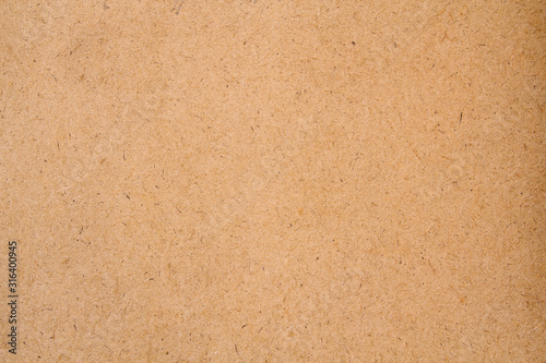 Brown fiberboard closeup texture background. Cartoon texture