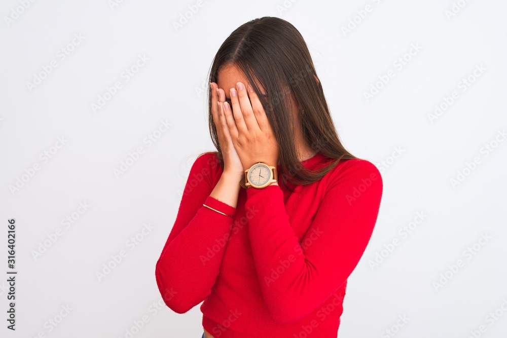 Young beautiful girl wearing red casual t-shirt standing over isolated white background with sad expression covering face with hands while crying. Depression concept. Young beautiful girl wearing red casual t-shirt standing over isolated white background with sad expression covering face with hands while crying. Depression concept.