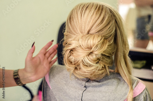 hairstyle back view, girl doing her hair