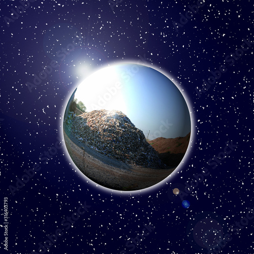 Globe as a large mountain of rubbish with sun reflection