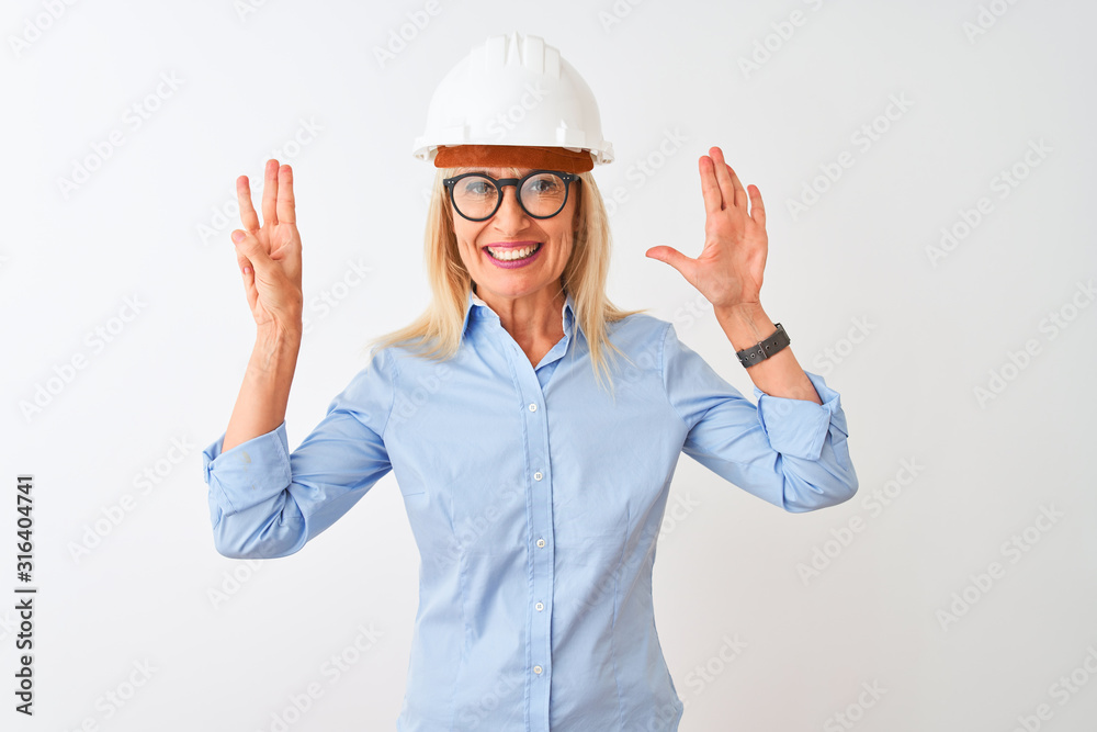 Middle age architect woman wearing glasses and helmet over isolated white background showing and pointing up with fingers number eight while smiling confident and happy.