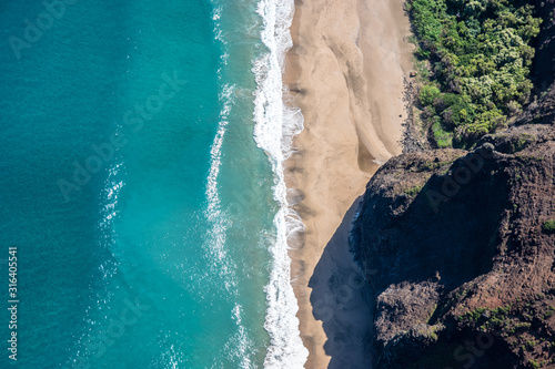 Aerial view of Kauai's lush colorful Na Pali coast landscape. 