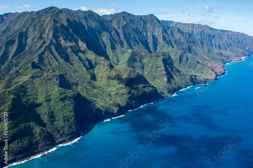 Aerial view of Kauai's lush colorful Na Pali coast landscape. 