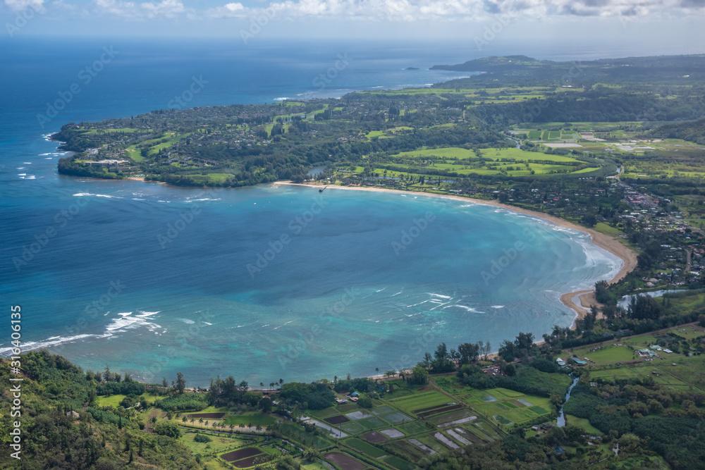 Obraz premium Aerial view of Kauai's lush colorful Hanalei Bay coastal landscape. 