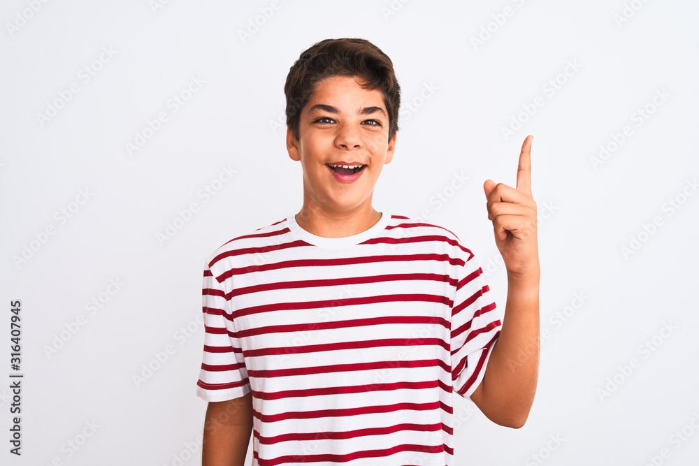 Handsome teenager boy standing over white isolated background pointing finger up with successful idea. Exited and happy. Number one. Handsome teenager boy standing over white isolated background pointing finger up with successful idea. Exited and happy. Number one.