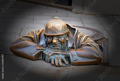 BRATISLAVA, SLOVAKIA - AUGUST 30 , 2019: Famous sculpture of Man at Work in the city center. Vignetting