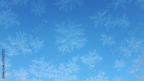 blue winter background with snowflakes