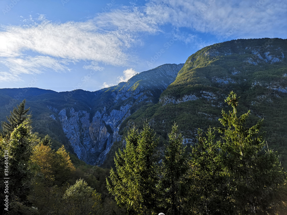 Beautiful mountains in the Isonzo valley with a waterfall