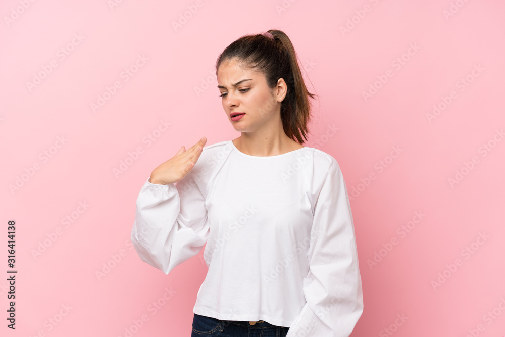 Young brunette girl over isolated pink background with tired and sick expression Young brunette girl over isolated pink background with tired and sick expression