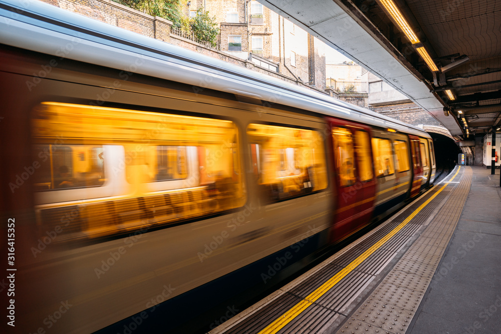 Subway train in motion in an underground station. Blur background of ...