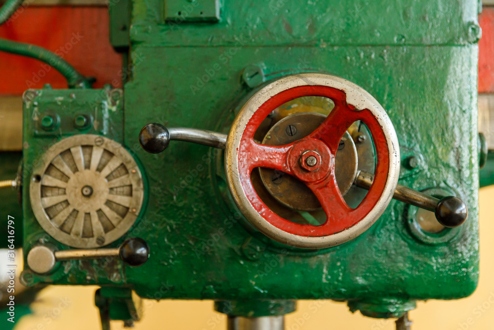 red controls of the Universal old and green Milling Machine red controls of the Universal old and green Milling Machine