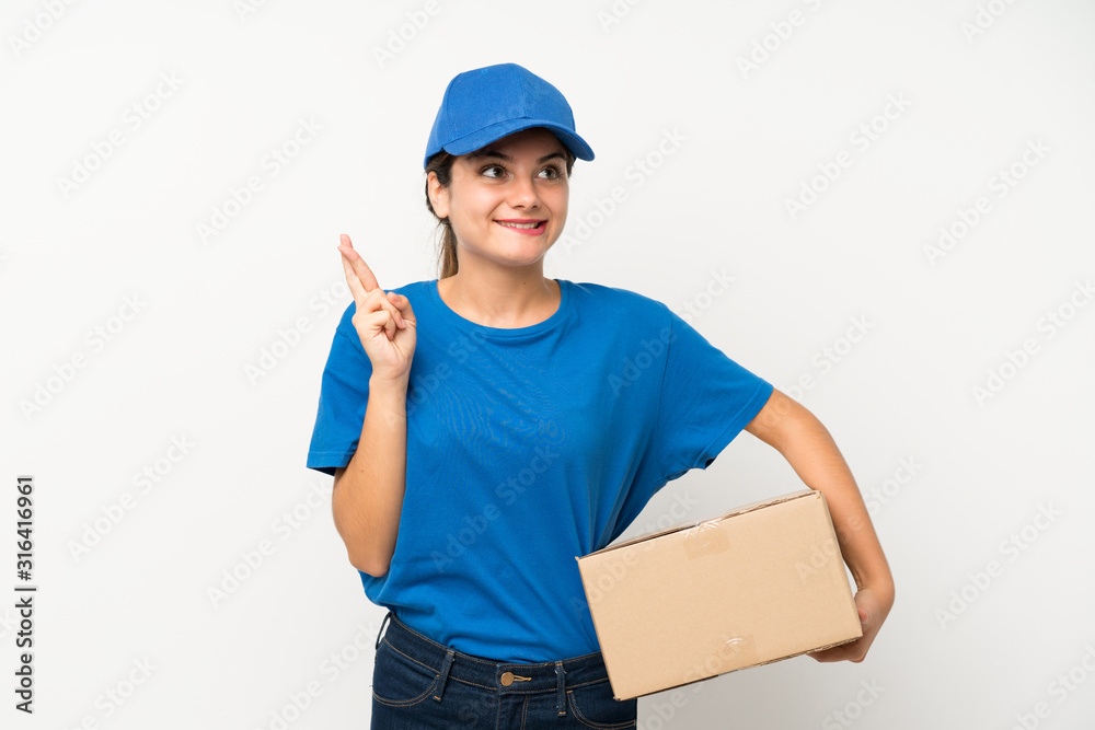 Young delivery girl over isolated white background with fingers crossing Young delivery girl over isolated white background with fingers crossing