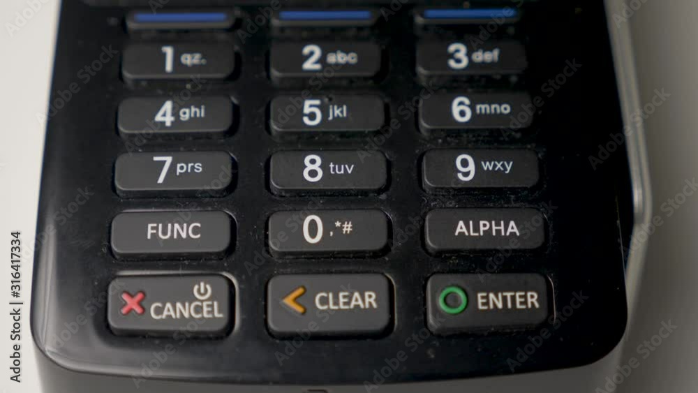 credit card in a black crocodile case is attached to a black terminal credit card in a black crocodile case is attached to a black terminal