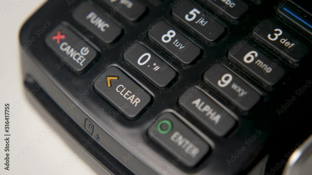 credit card in a black crocodile case is attached to a black terminal credit card in a black crocodile case is attached to a black terminal