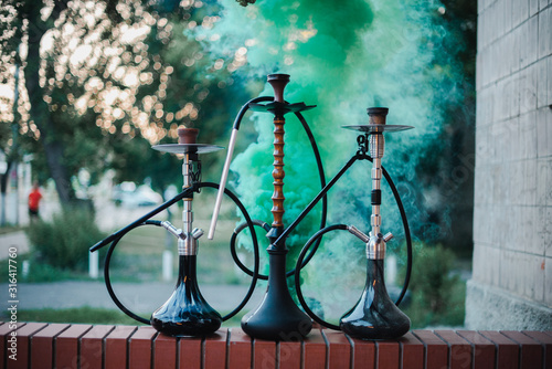 Hookah outdoors on a background of colored smoke © prokop.photo