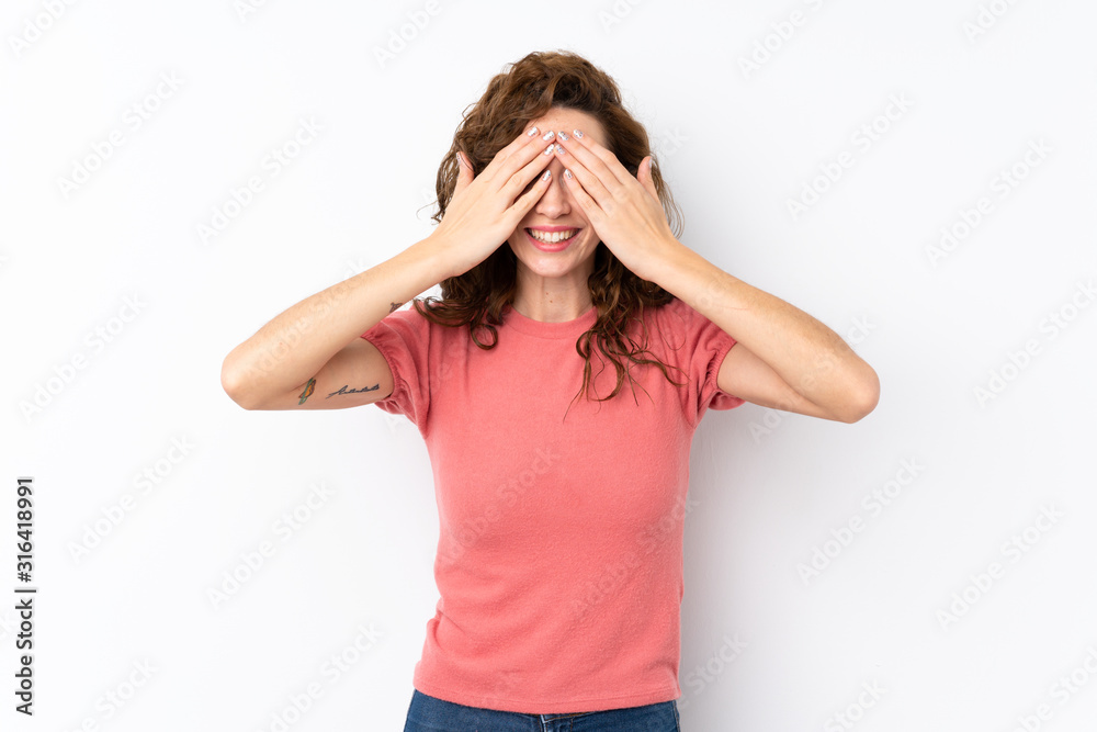 Young pretty woman over isolated background covering eyes by hands Young pretty woman over isolated background covering eyes by hands
