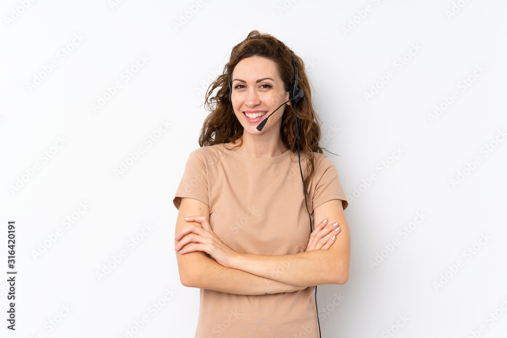 Young pretty woman over isolated background working with headset Young pretty woman over isolated background working with headset