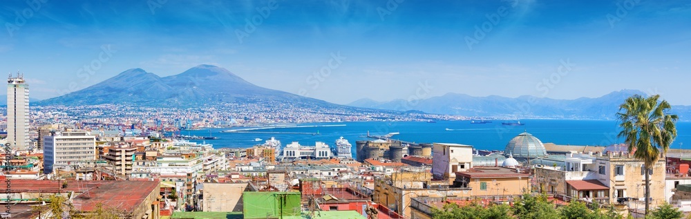 Panoramic view of Naples, Italy. Castel Nuovo and Galleria Umberto I towering over roofs of neighboring houses of Naples.