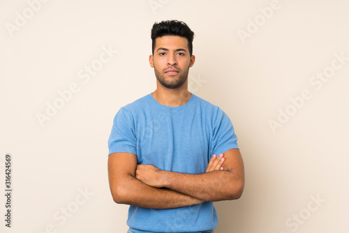 Young handsome man over isolated background feeling upset