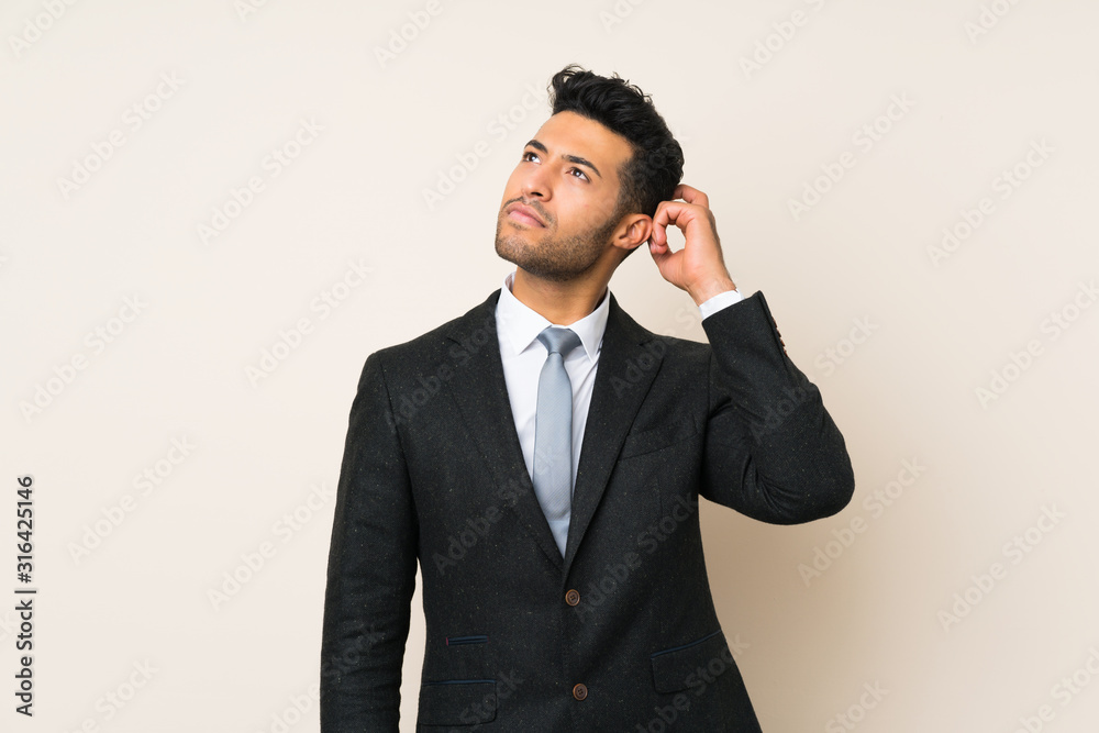 Young handsome businessman man over isolated background having doubts and with confuse face expression Young handsome businessman man over isolated background having doubts and with confuse face expression