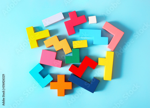 Wooden tangram cubes as a symbol of riddle