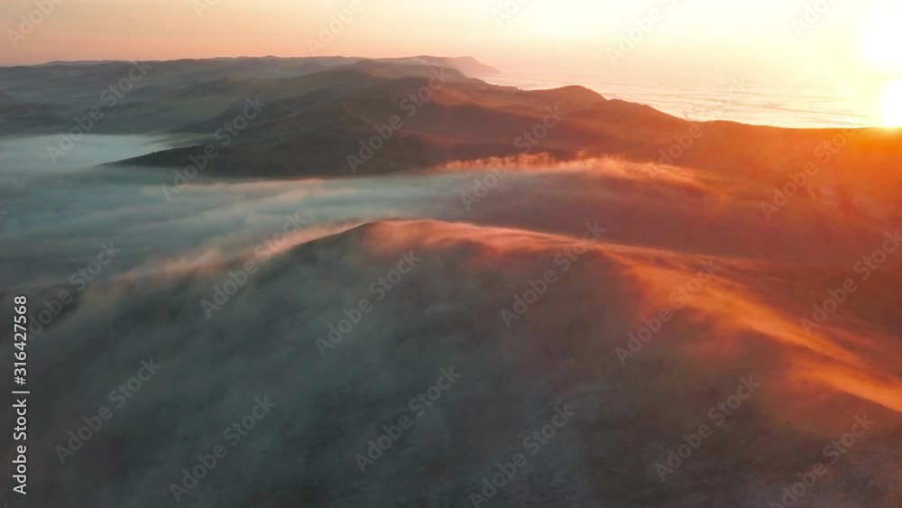 Aerial view of Olkhon Island at misty dawn. Lake Baikal in winter