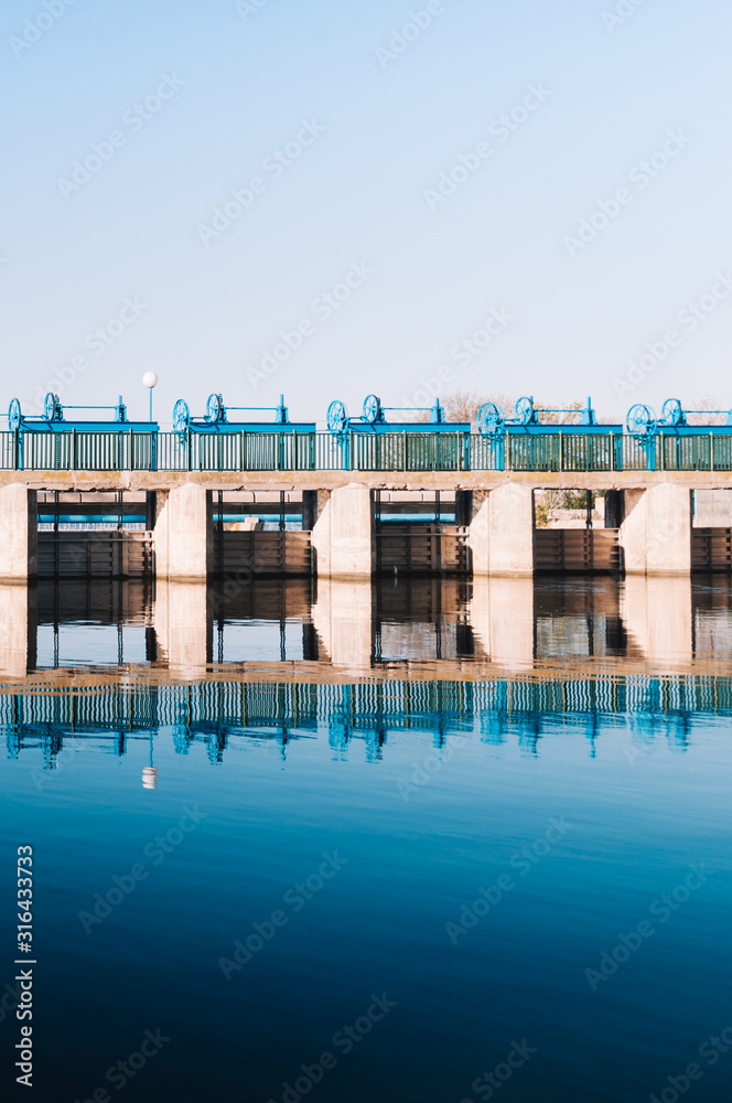 Dam of Gola of Pujol in Albufera lake. Symmetrical image