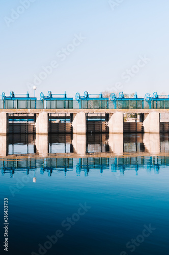 Dam of Gola of Pujol in Albufera lake. Symmetrical image