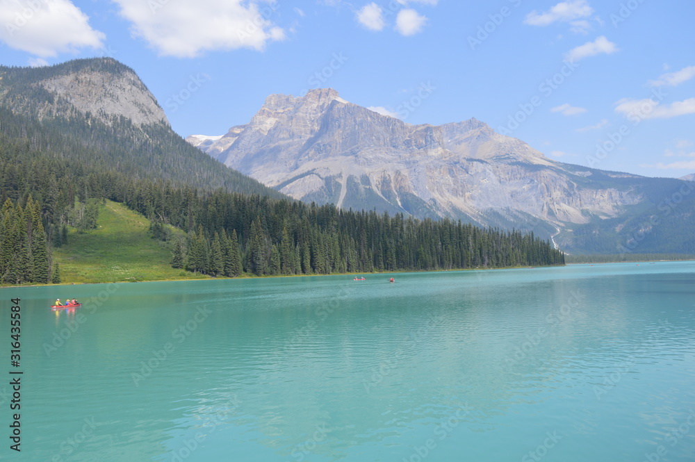  Green Lake with Calm Waves Overlooking Mountains and Forest. Green Alpine Glacier Lake in Canadian Rocky Mountains, Emerald Lake, Yoho National Park, British Columbia, Canada.