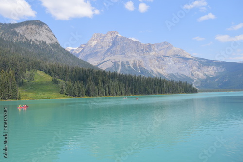  Green Lake with Calm Waves Overlooking Mountains and Forest. Green Alpine Glacier Lake in Canadian Rocky Mountains, Emerald Lake, Yoho National Park, British Columbia, Canada.