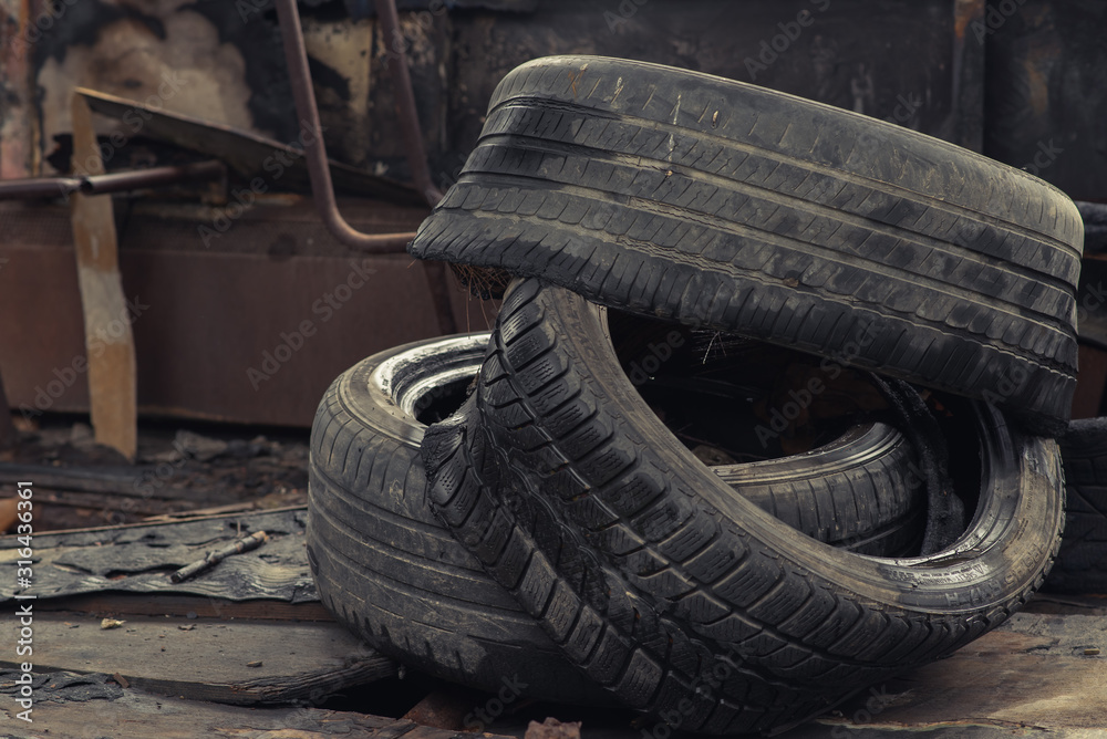 car tires are stacked one on the other with a tread car tires are stacked one on the other with a tread