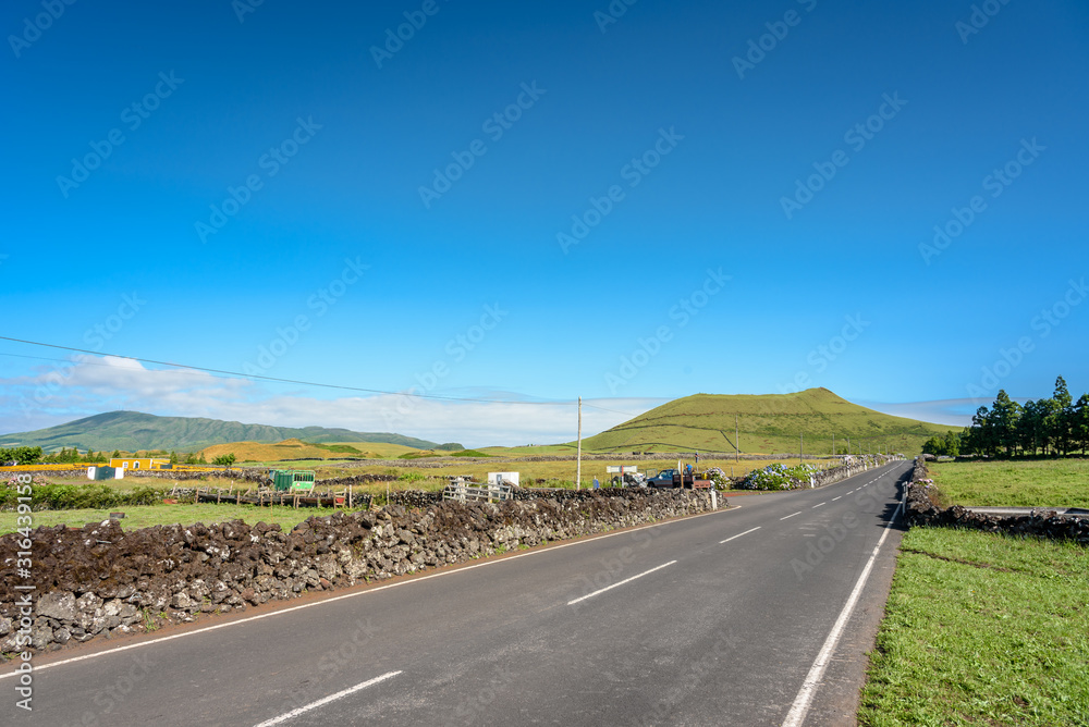 landscape with street in terceira, view of the hills and volcano in the middle of terceira island. azores. portugal