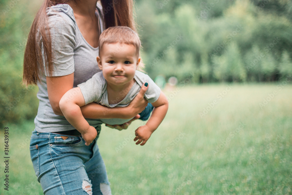 Fototapeta premium Mother play with son in the park.