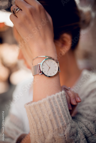 Stylish fashion white watch on woman hand
