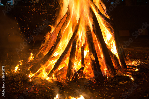 Canvas Print Giant bon fire lit for the festival of Lohri